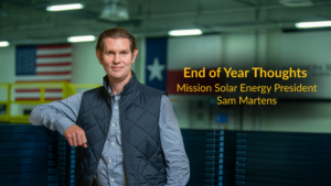 Businessman in factory with American flag